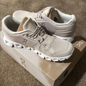 On Running Cream and White Athletic Shoes